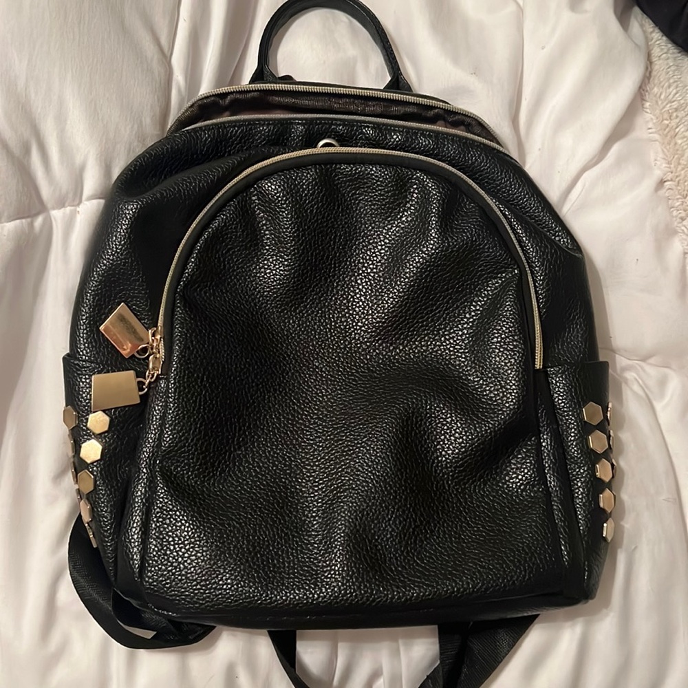 Black medium backpack with gold studs